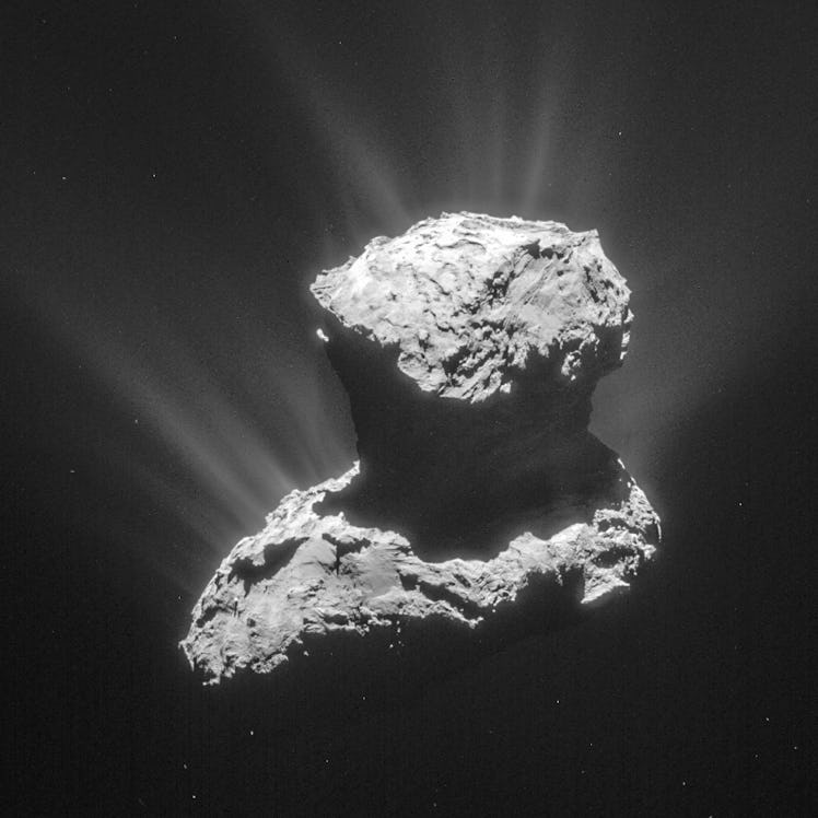 67P/Churyumov-Gerasimenko with vapor shooting out of its two lobes. 