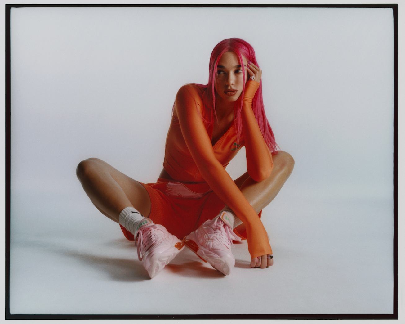 Dua Lipa wearing the second release of her Flutur 2 collection with Puma