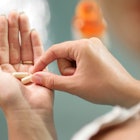 A woman holding abortion pills.