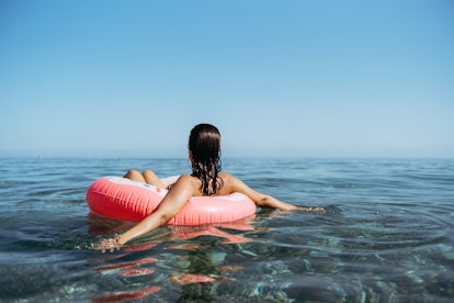 woman floating in the ocean