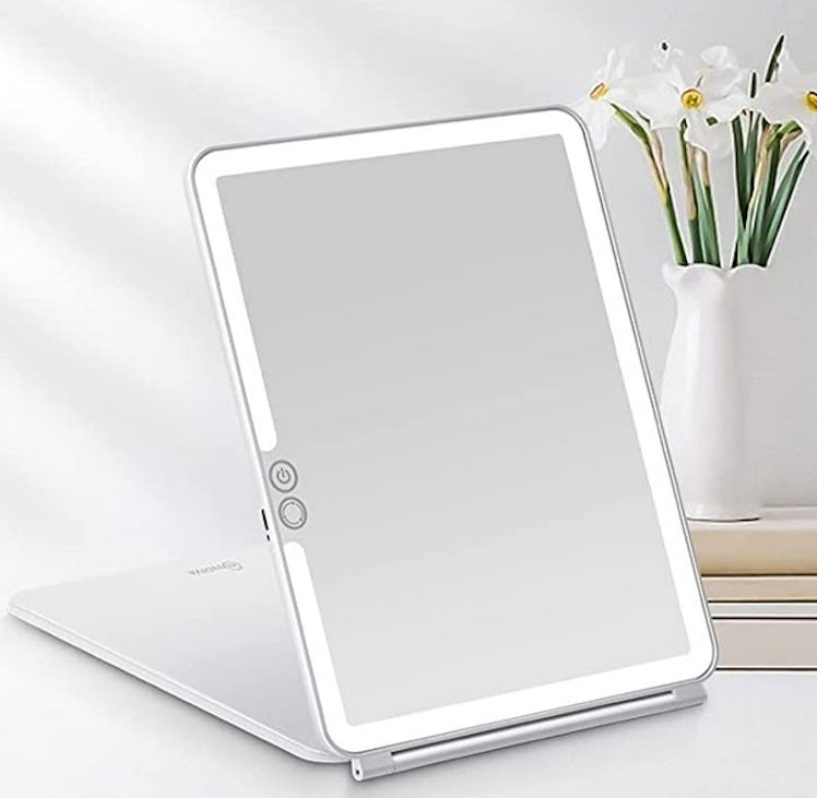 A Folding Light-Up Travel Mirror, which is on sale for 20% Off for Amazon Prime Day 2022.