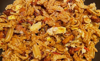 Stir-fried noodle dish with Italian pasta.