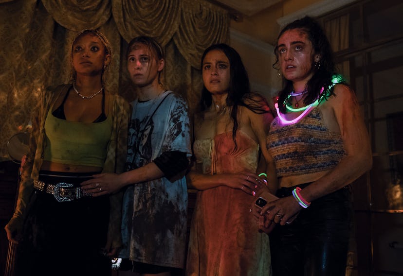 Amandla, Maria, Chase, and Rachel wearing glow sticks and looking scared