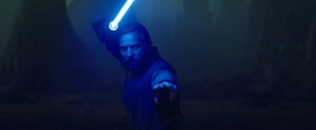Ewan McGregor poses with his blue lightsaber in Obi-Wan Kenobi Episode 6
