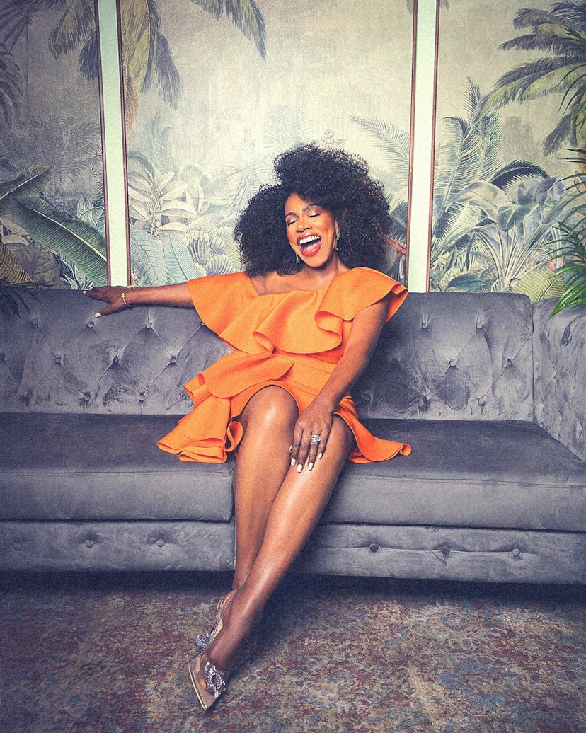 Sheryl Lee Ralph wearing an orange dress and grinning