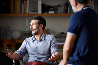 A man in an office talking.