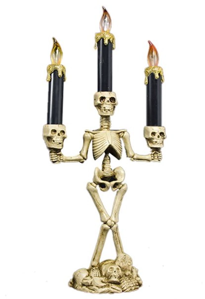 This Coxeer Skeleton Head LED Flameless Light Candle Lamp is a Halloween decoration available at Wal...