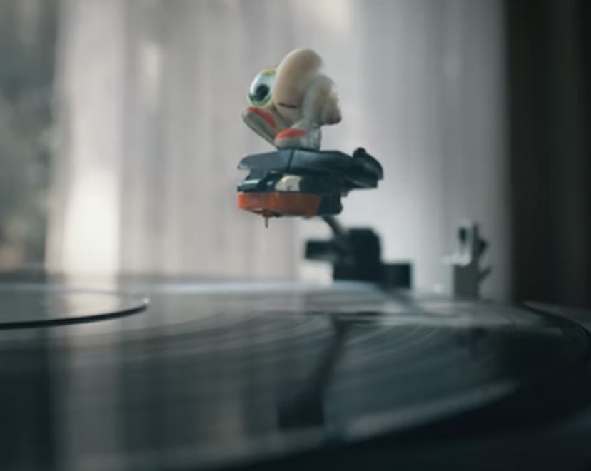 Marcel the Shell with Shoes On balanced on a record player needle.
