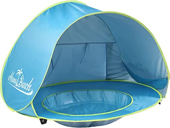 Beach toys for babies don't get any better than a tiny portable pool complete with a sun shade.