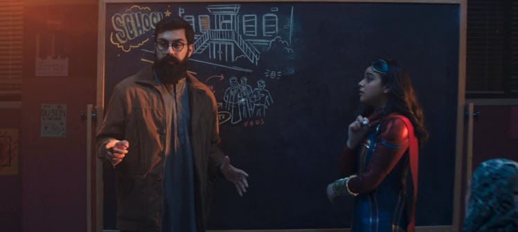Aamir Khan (Saagar Shaikh) and Kamala (Iman Vellani) standing in front of a chalkboard in "Ms. Marve...
