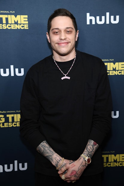 Pete Davidson smiling on a Hulu red carpet