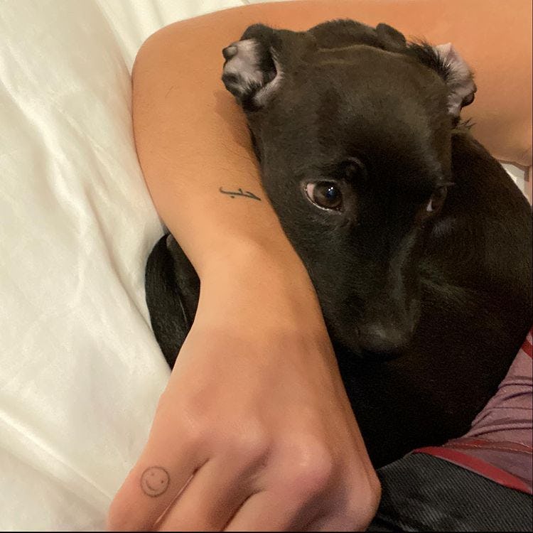 Dua has a smiley face tat on her finger.