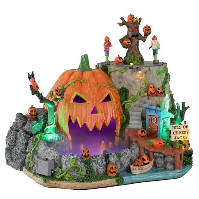 This Isle of Creepy Jacks is part of the Lemax Spooky Town collection and it lights up and has mist ...