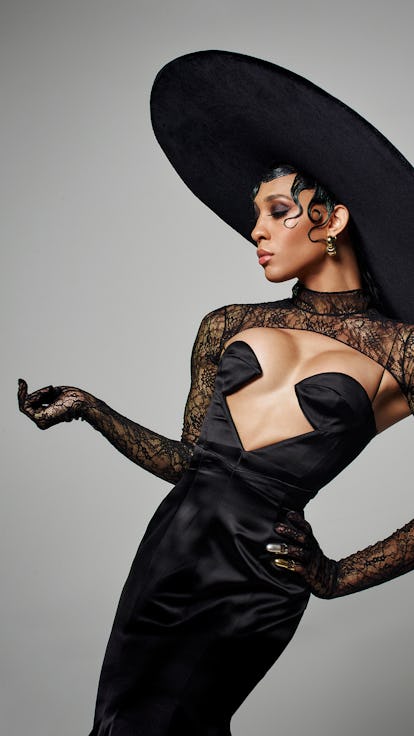 Michaela Jaé Rodriguez poses in a black Gucci dress and oversized hat on the set of her cover photo ...