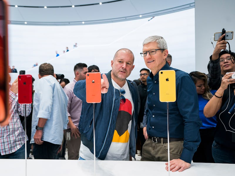 Jony Ive and Tim Cook look at iPhones