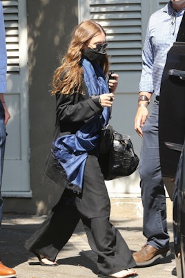 Ashley Olsen is escorted to her car after some shopping on trendy Melrose Place in West Hollywood.
