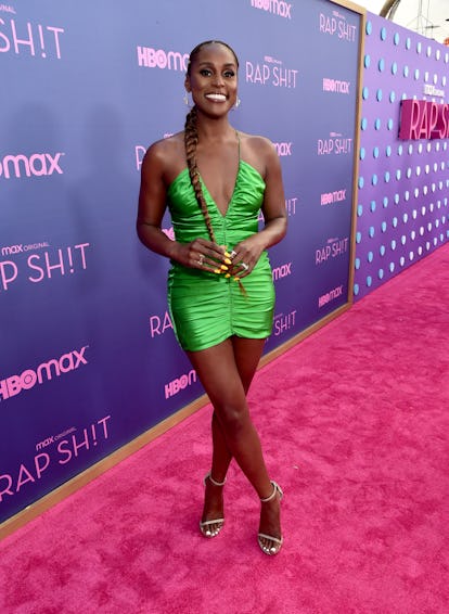 Issa Rae wearing a slime green mini dress