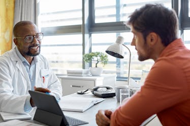 A man talking to his doctor about a vasectomy reversal.