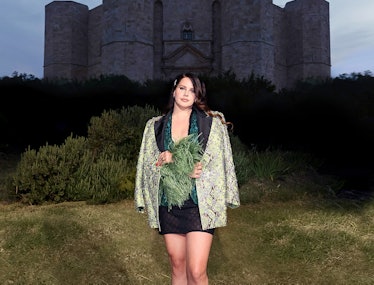 Lana Del Rey infront of a castle. 