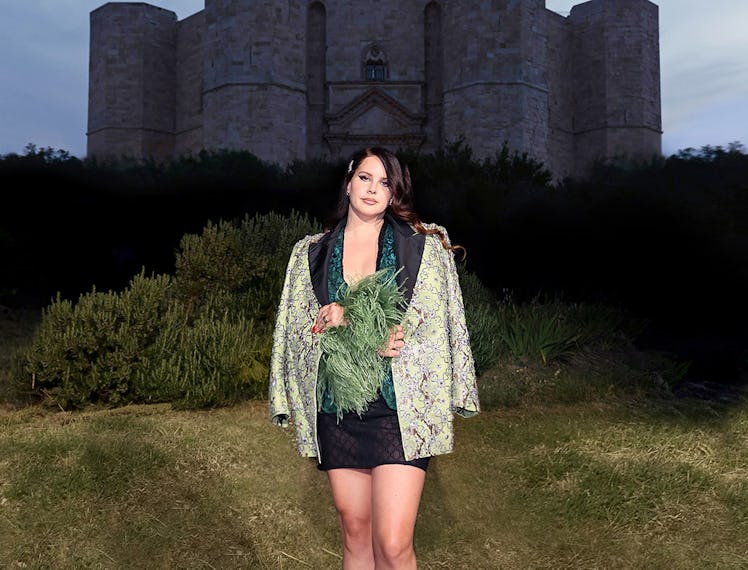 Lana Del Rey infront of a castle. 