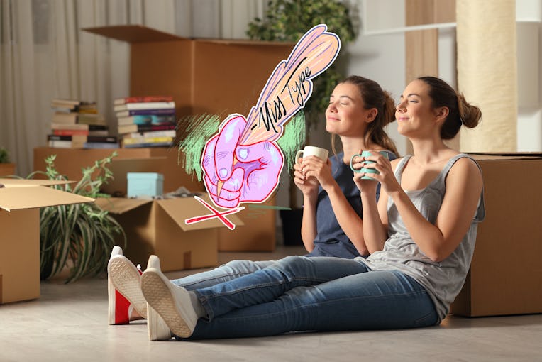 Two happy roommates moving home resting breathing fresh air sitting on the floor in the night.