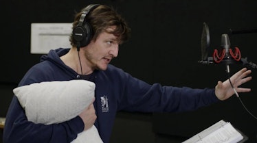 Pedro Pascal clutching a pillow while recording voice work for The Mandalorian