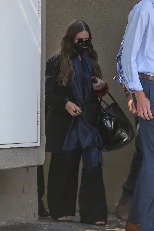 Ashley Olsen wearing an oversized black blazer and pants