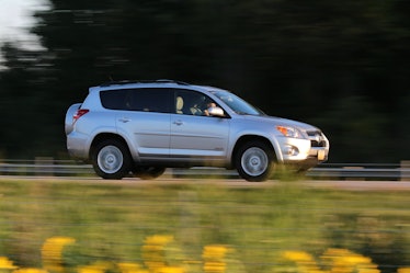 Fast-moving SUV on a rural highway.