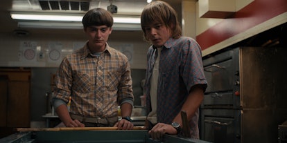 Noah Schnapp and Charlie Heaton, who play brothers Will and Jonathan, share an emotional moment in S...