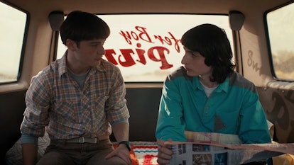 Will and Mike looking at each other in a van in 'Stranger Things' season 4