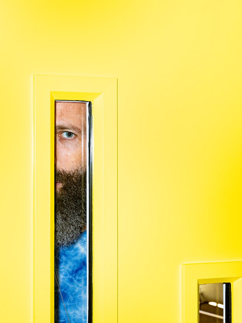 Elan Gale posing behind yellow doors
