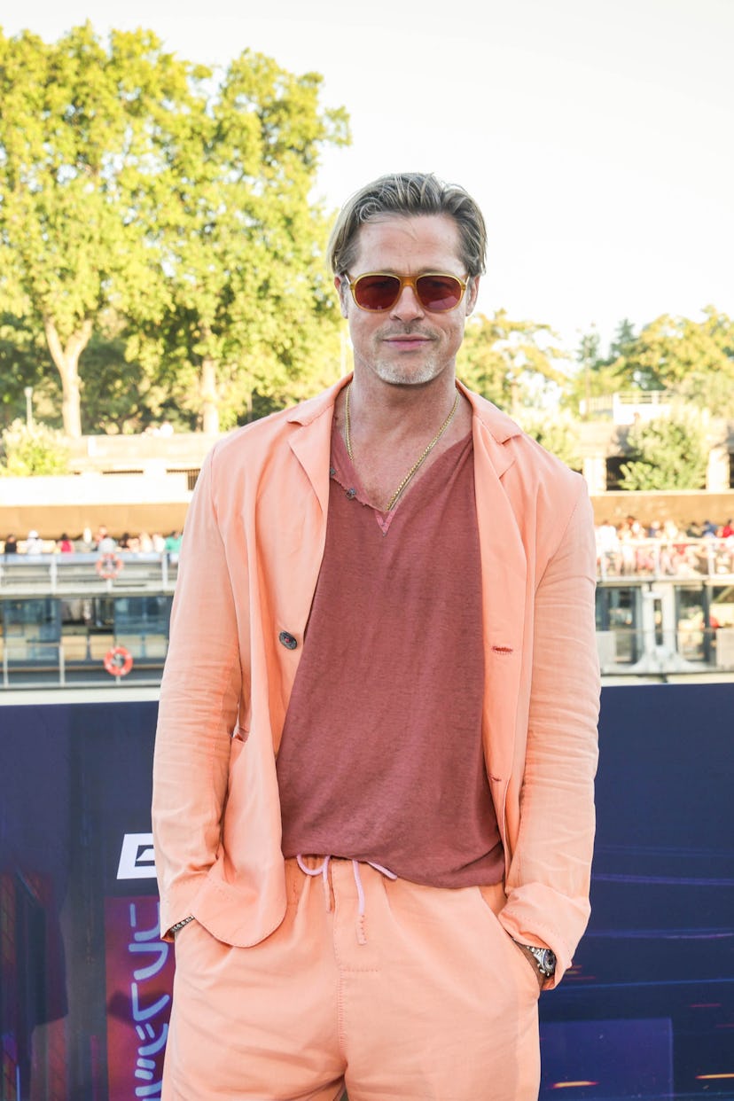 Brad Pitt wearing a bright blazer and sunglasses