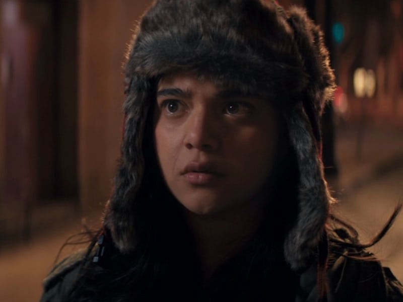 Iman Velanni as Kamala Khan having a serious face expression, while wearing a winter cap on the stre...
