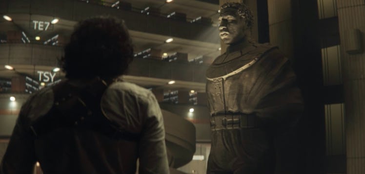 The MCU’s God of Mischief (Tom Hiddleston) looks at a statue of Kang the Conqueror at the end of Lok...