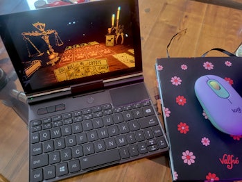 GPD Pocket pictured running the game Inscryption