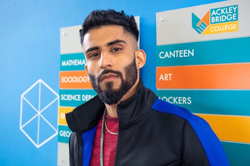 Acklney Bridge character HASSAN played by HAREET DEOL. Pictured stood against a school notice board ...