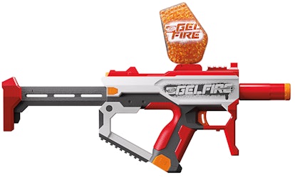 The  Nerf Pro Gelfire Water Gun in red with a compartment on the top full of small orange water pods