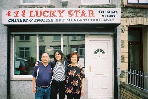 Angela Hui and her parents, outside the takeaway