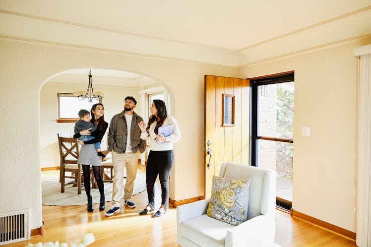 Family that is a first-time home owner inside their home