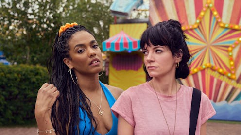 Freema Agyeman and Lily Allen in a still from Sky's Dreamland. They're photographed against a fairgr...