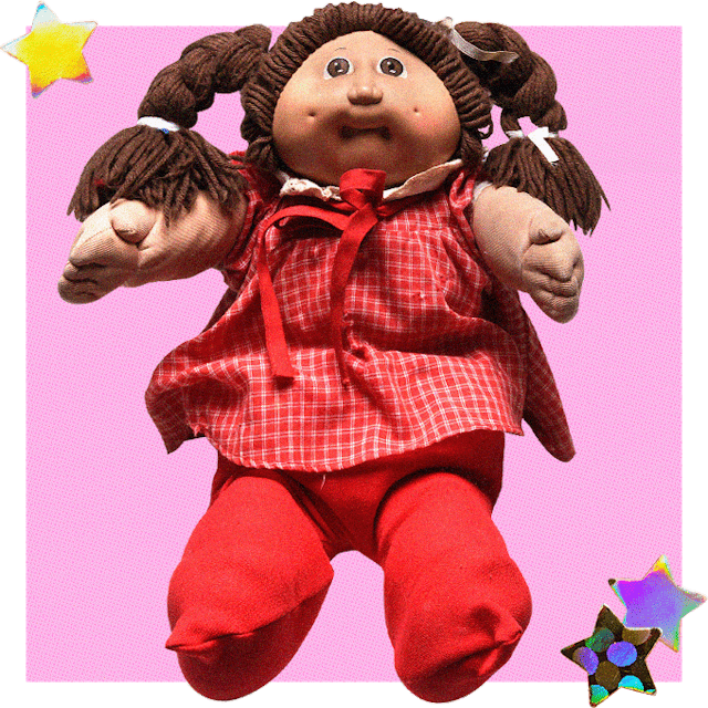 Cabbage Patch Kids Doll With Brown Hair And A Red Dress