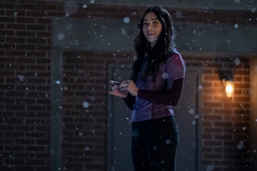 Kate Bishop (Hailee Steinfeld) smiles while it snows in Hawkeye Episode 1