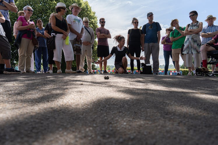 Dancer Marega Palser intervenes on a group walk in Caerleon.