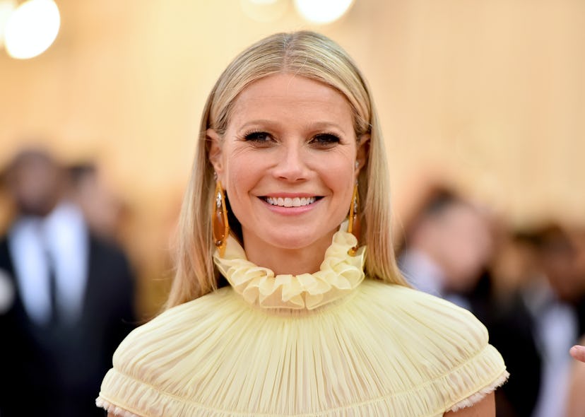 Gwyneth Paltrow wearing yellow and smiling