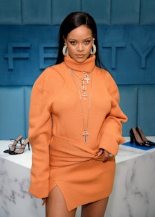 Rihanna wearing a knit orange turtleneck dress