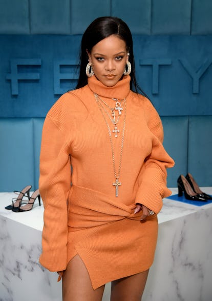 Rihanna wearing a knit orange turtleneck dress