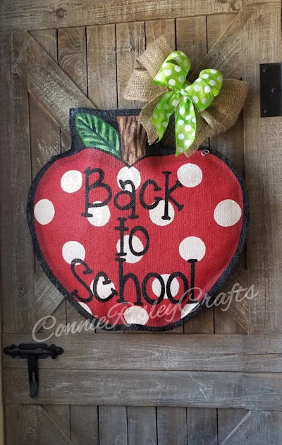 Don't forget a wreath, like this handmade apple door hanger, when buying back-to-school decorations.