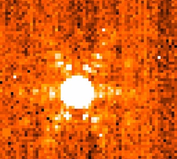 image of a star, white against a mottled orange background