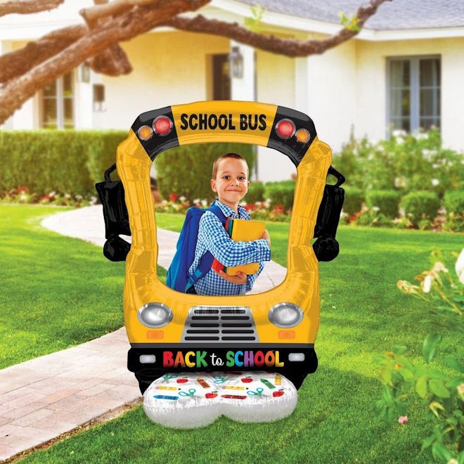 Your back-to-school decorations should include a photo prop or two, like this inflatable bus balloon...