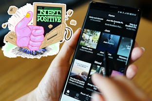Net positive logo next to someone scrolling spotify on their phone.
